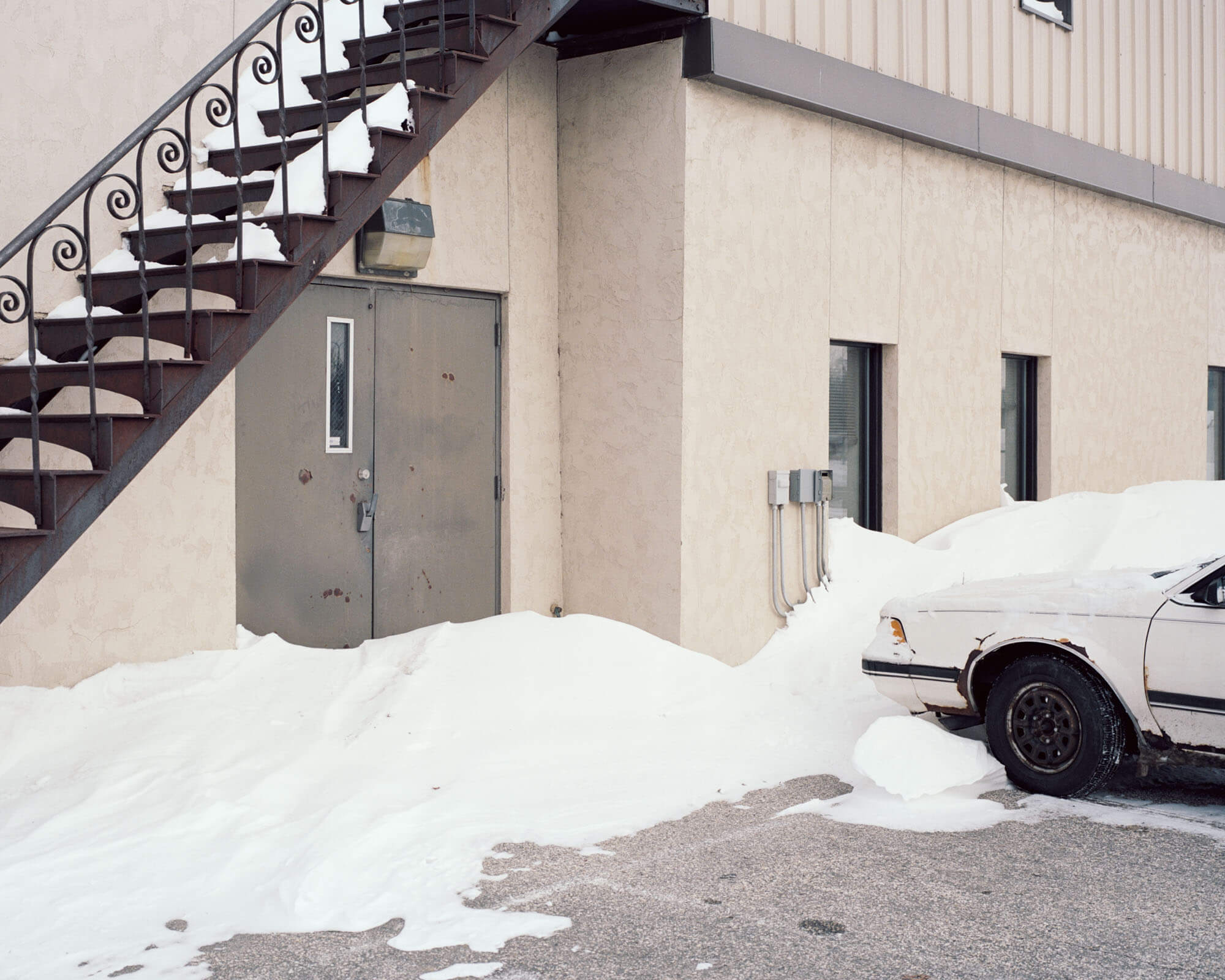 A partially cleared snowy car park in Rochester, Minnesota, USA